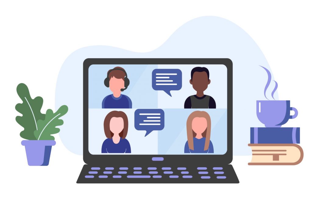 Laptop showing online meeting with coffee and a plant to the side.
