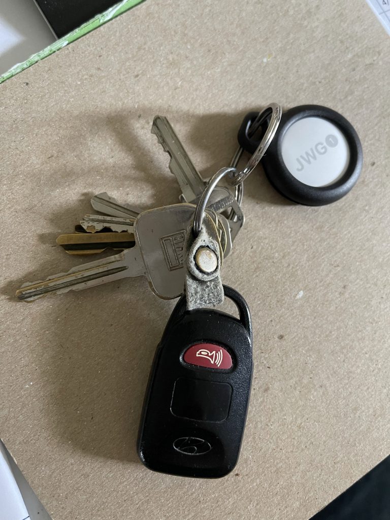 Set of keys with an Apple AirTag attached.