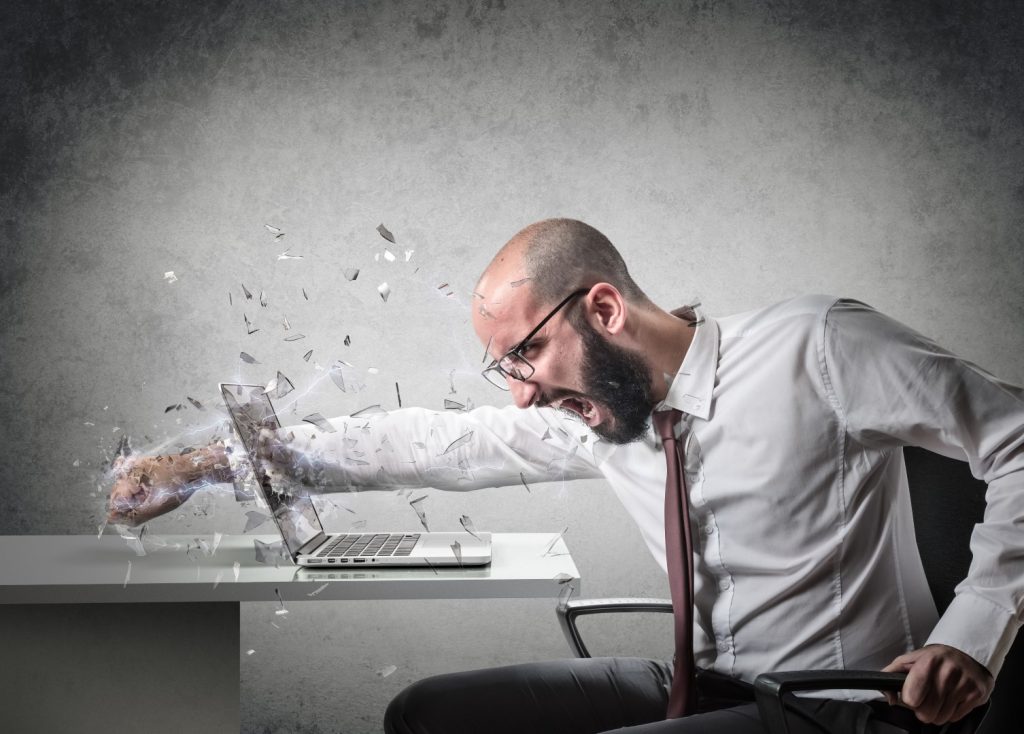 This man smashing his computer may not realize that it's not always your computing device.
