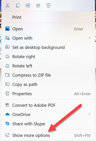 The Windows 11 right-click menu with an arrow pointing to "Show more options."