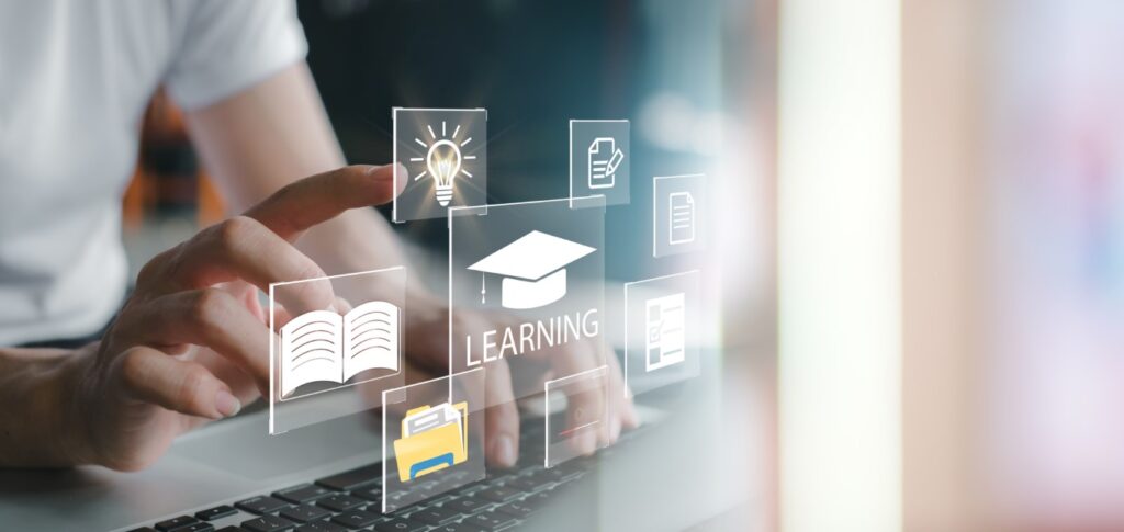 In-Person Seminar showing touchscreen and finger pointing and the word "Learning"