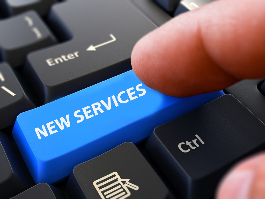 Two New Services - picture of keyboard key with "NEW SERVICES" printed on it